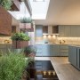 Architectural Mews House, Belsize Park | Kitchen Plant Wall | Interior Designers